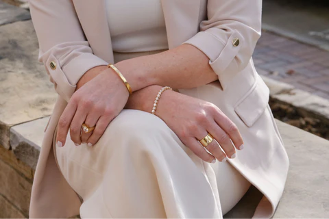 wearing bangles on both hands